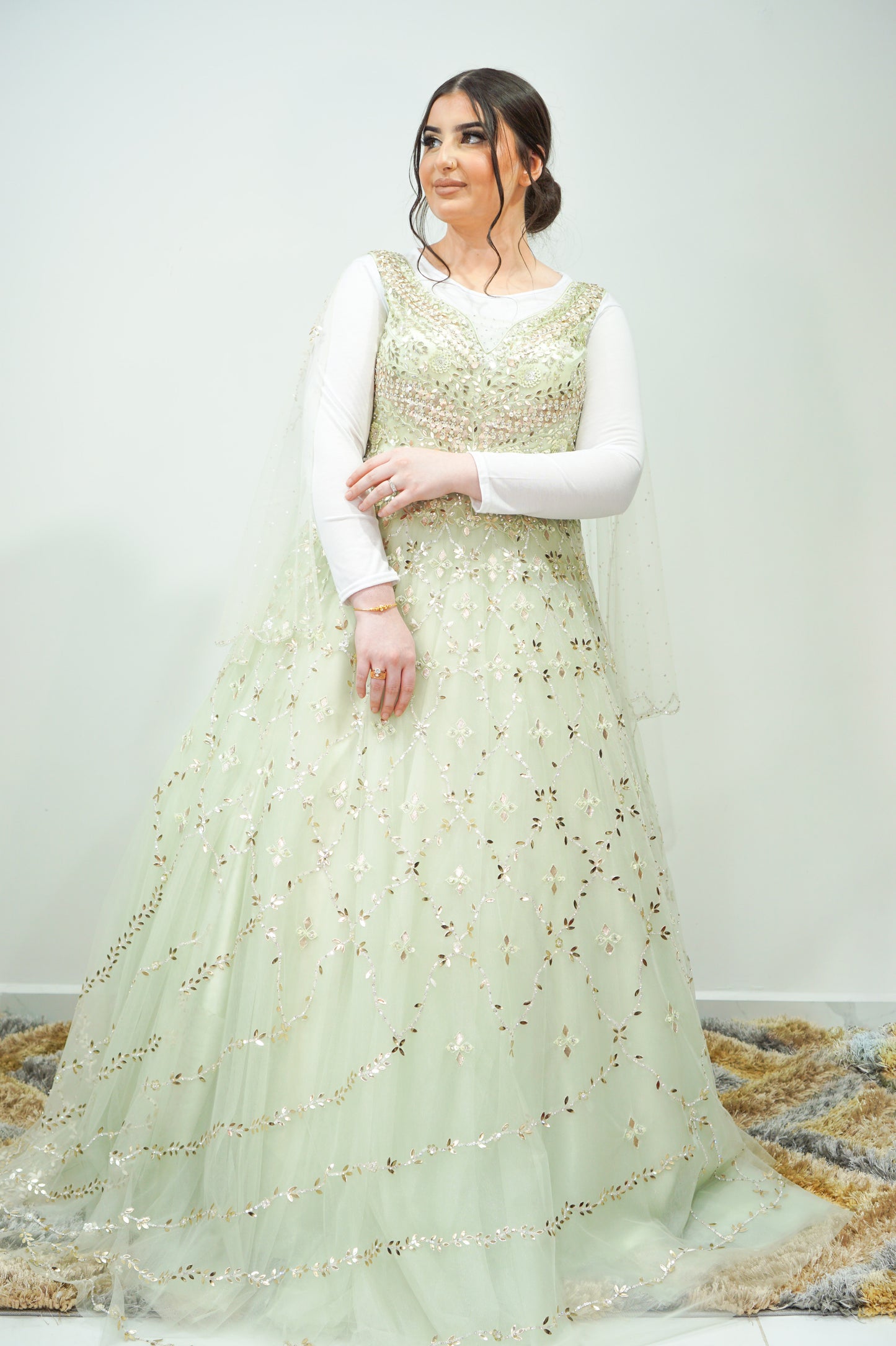 Sleeveless Pastel Green Net Gown with Gotapatti Design, Sequins, and Stone Embellishments